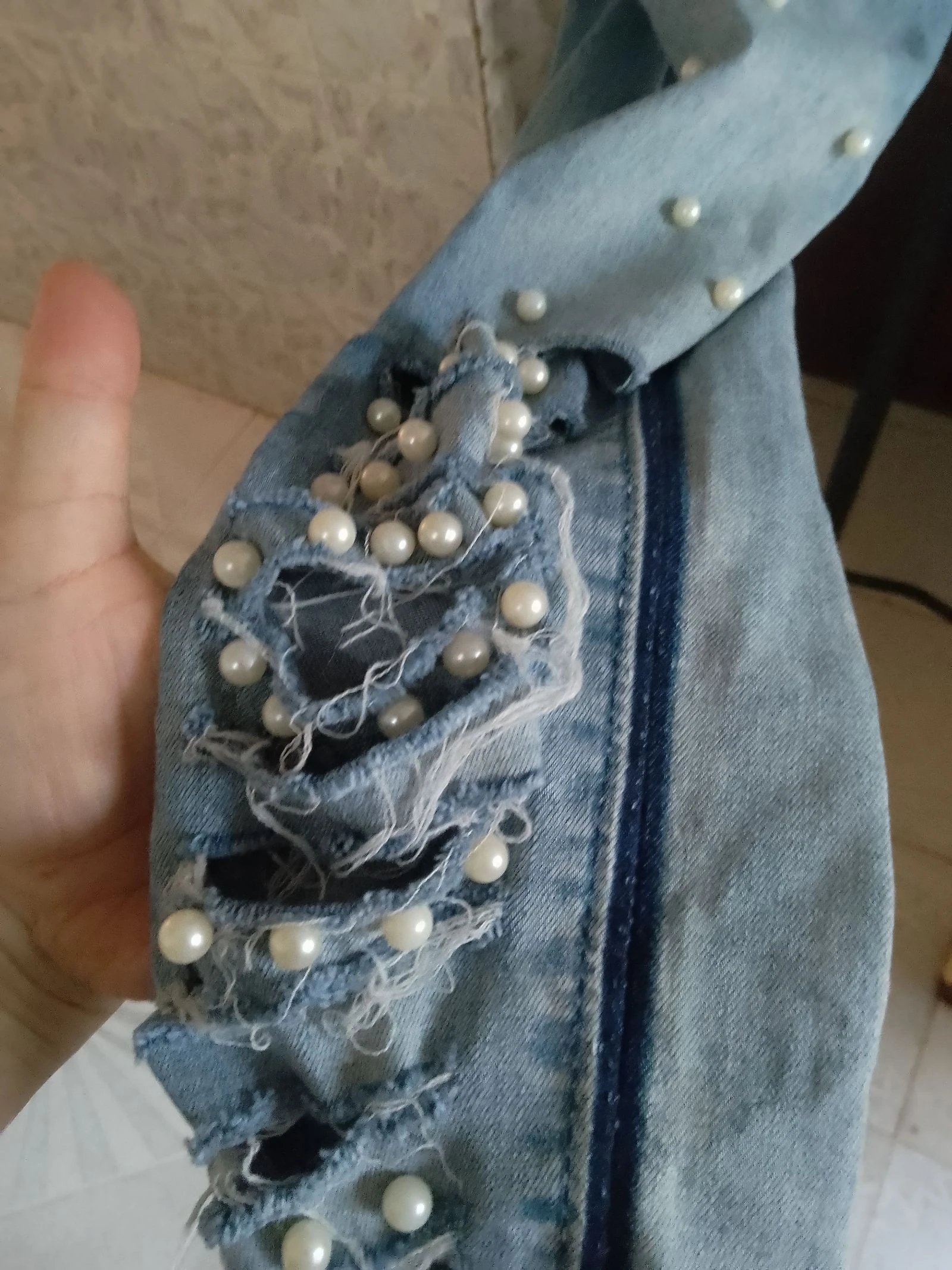 Denim pants with openings and balls – photo 4